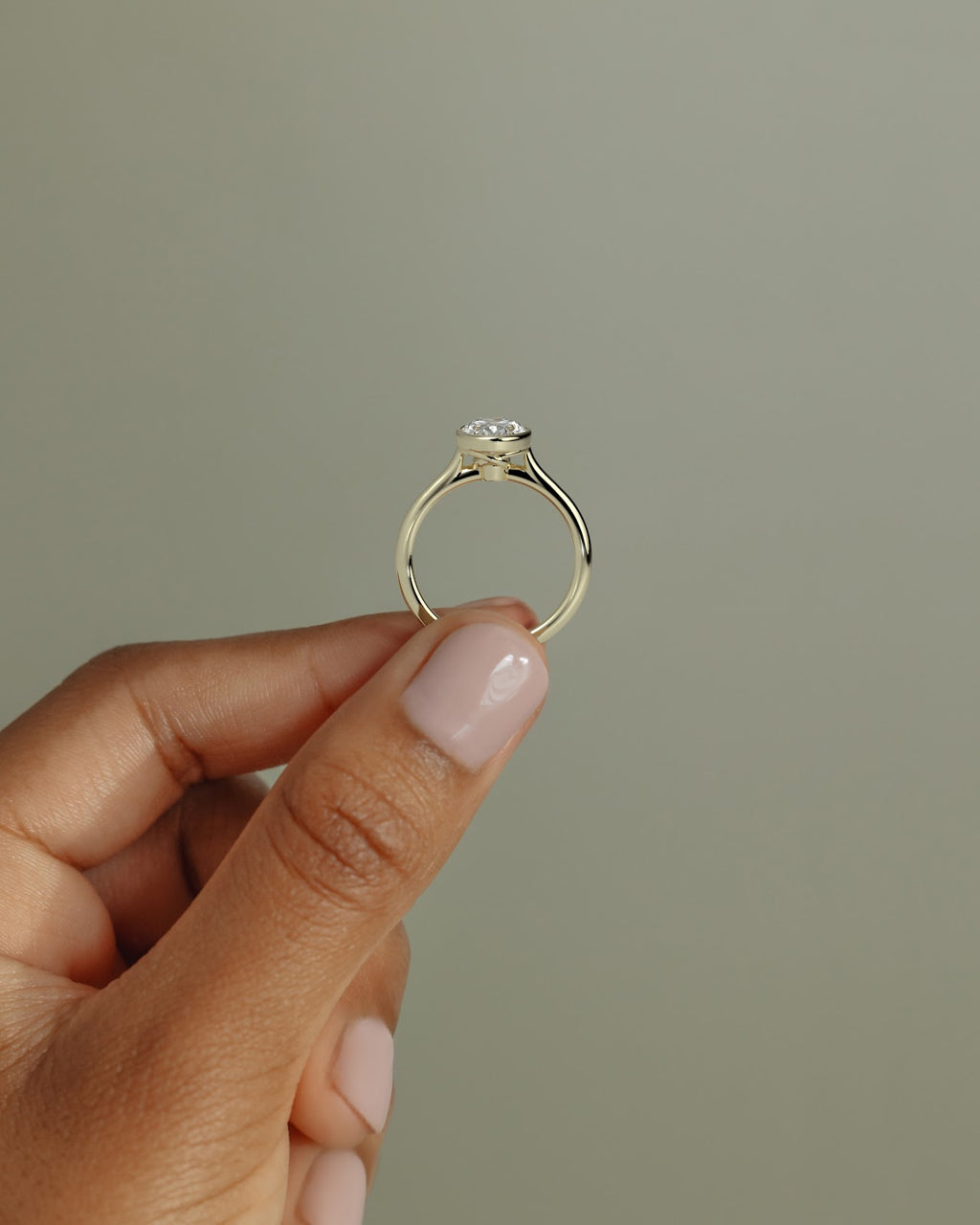 Oval Diamond Twist Gallery Bezel Solitaire Engagement Ring