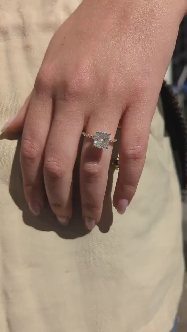 Cushion cut lab grown diamond engagement ring with pave band in 14K gold, featuring soft corners and radiant sparkle.