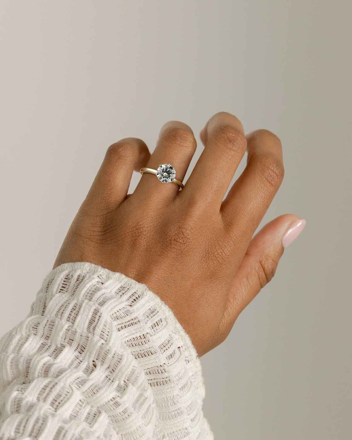 Round Diamond Encircled Hidden Halo Engagement Ring